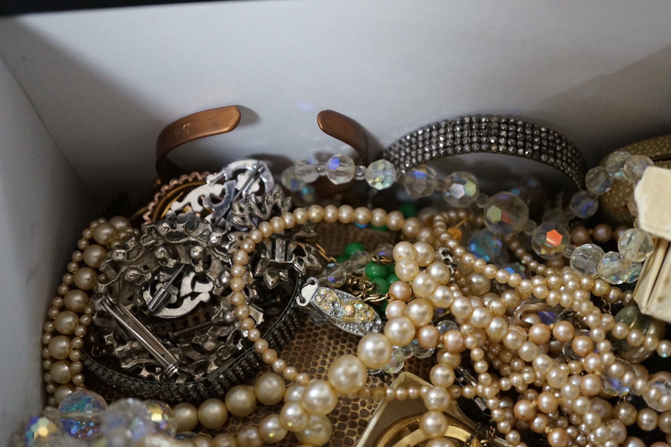 A yellow metal and gem set ring and a large quantity of assorted costume jewellery.
